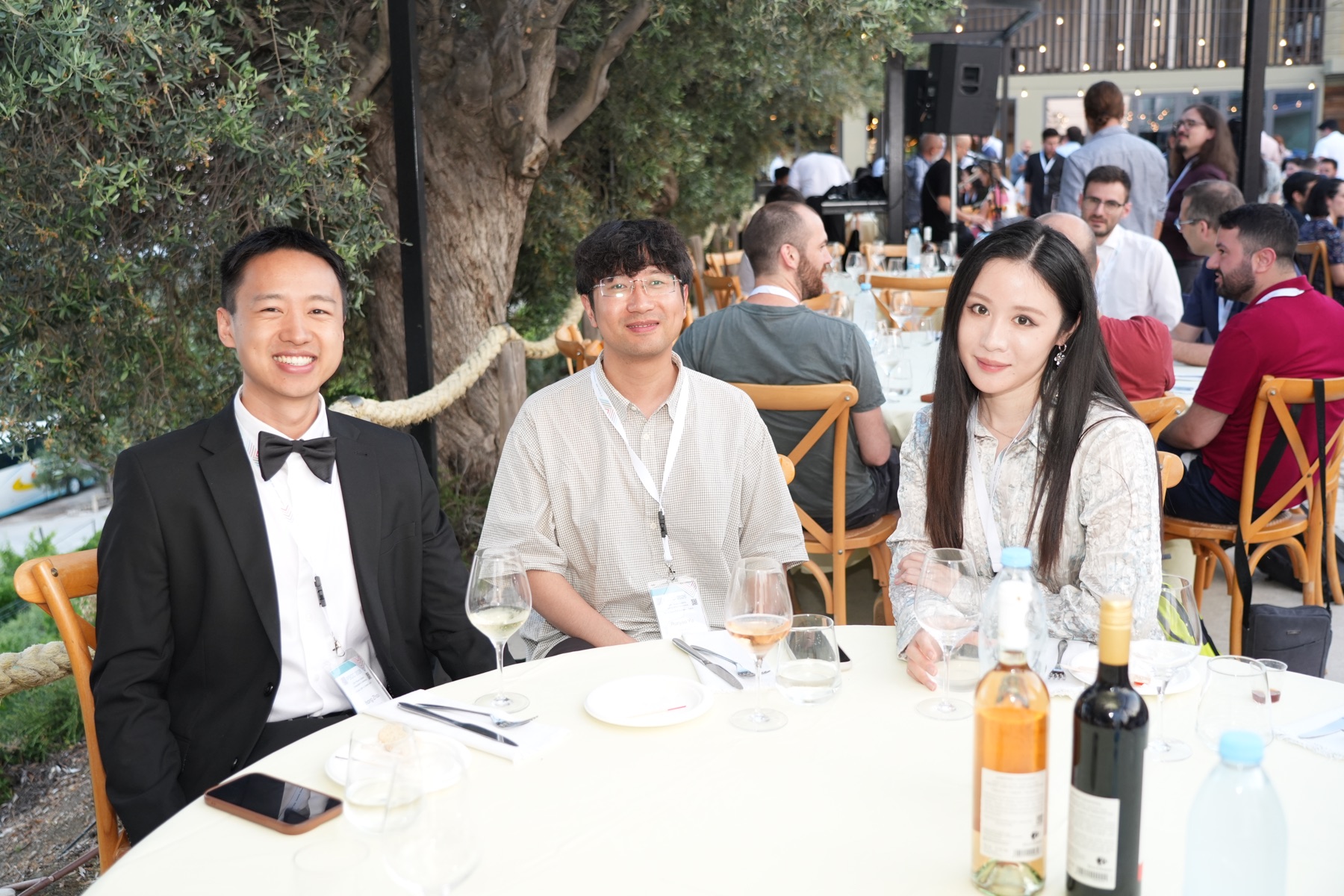 Yihong Zhou with colleagues at the PSCC 2026 dinner